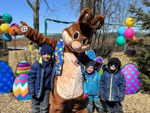 Children meeting the Easter Bunny mascot at the Kustermans Adventure Farm event