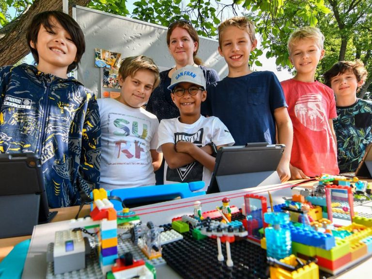 Campers building Lego structures during a Lego challenge at Kustermans Summer Camp