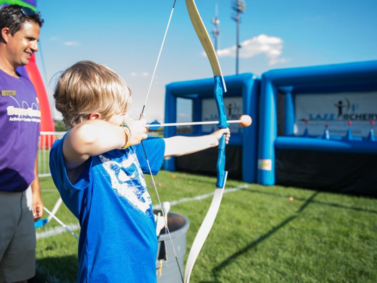 Campers trying soft-tip bow and arrow archery at Kustermans Summer Camp