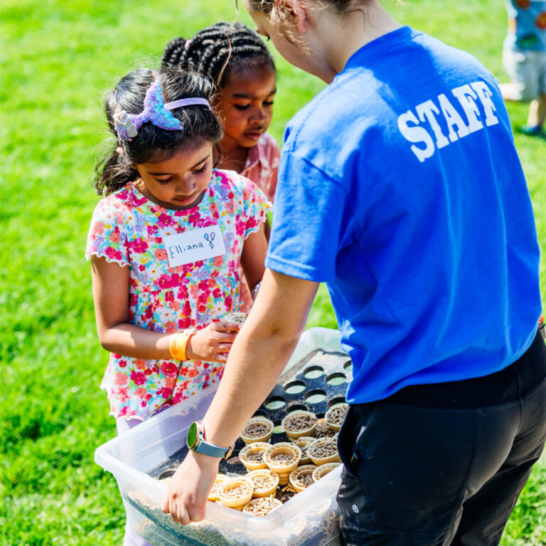 Animal feed cones being used to feed farm animals during a birthday party at Kustermans