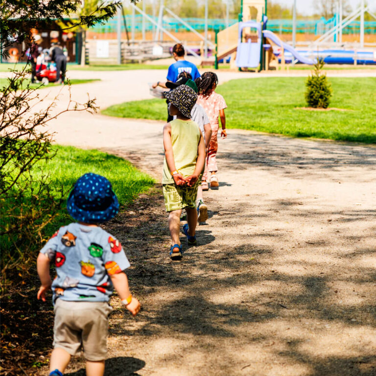 Children playing barnyard games at a Kustermans Farm birthday celebration