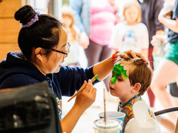 Child getting face painted at the Kustermans Fall Festival