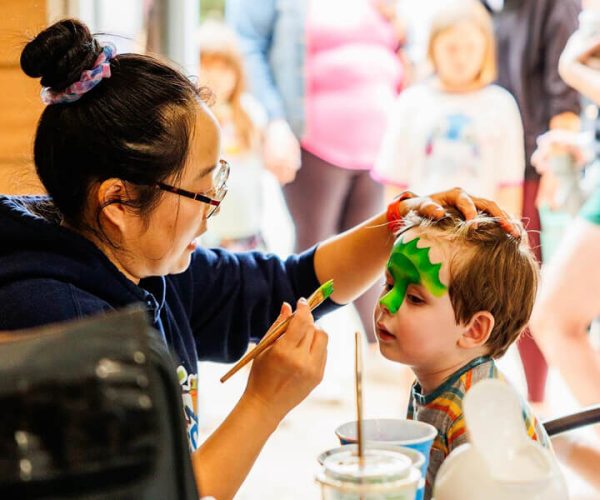 Child getting face painted at the Kustermans Fall Festival